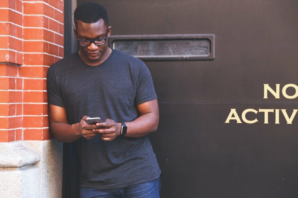 man searching websites on smartphone